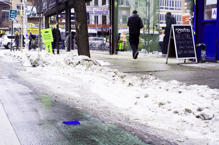 Street shot. Alexis Dahan, Newsstand and Blue Puddle, 2015